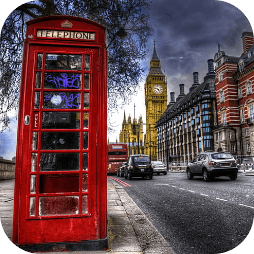 Red telephone box on a London street near Big Ben