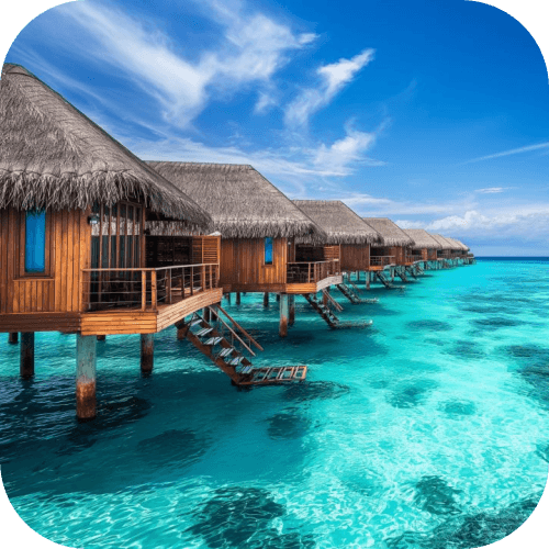Overwater bungalows lining a turquoise Maldives lagoon