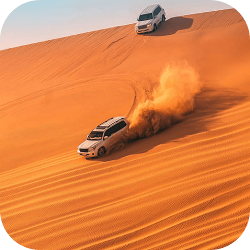 Desert safari with off-road vehicles racing across sand dunes