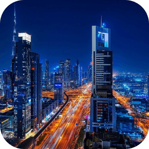 Dubai skyline at night with illuminated skyscrapers and city lights